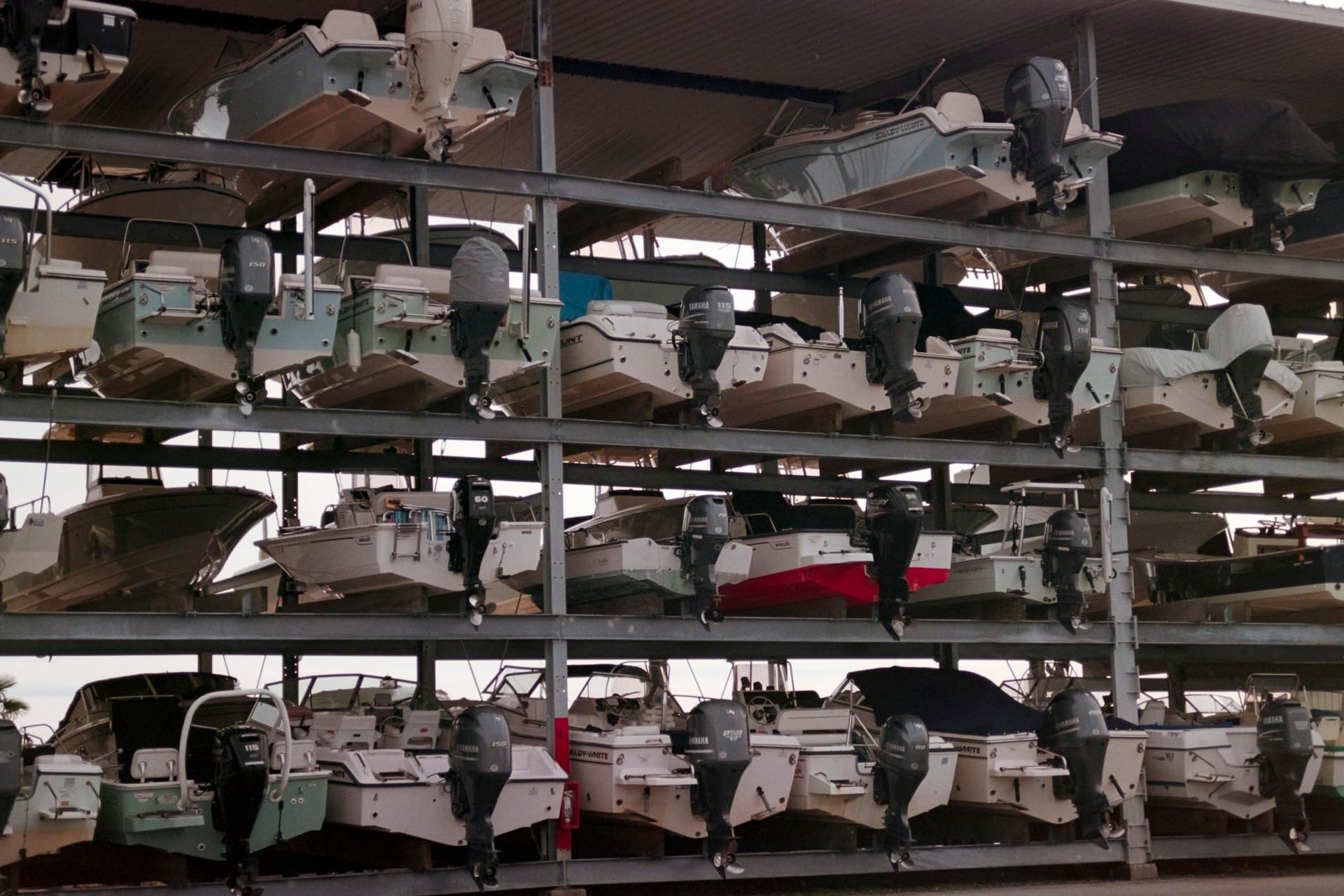 Boats stored on multi-level racks at a marina storage facility